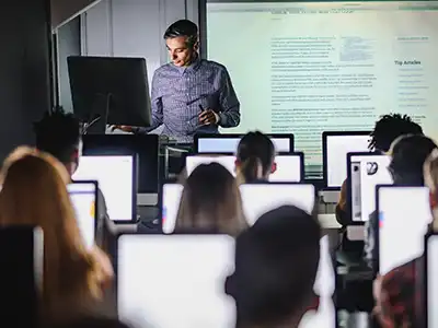 A small business owner takes inventory using an Internet-connected device.